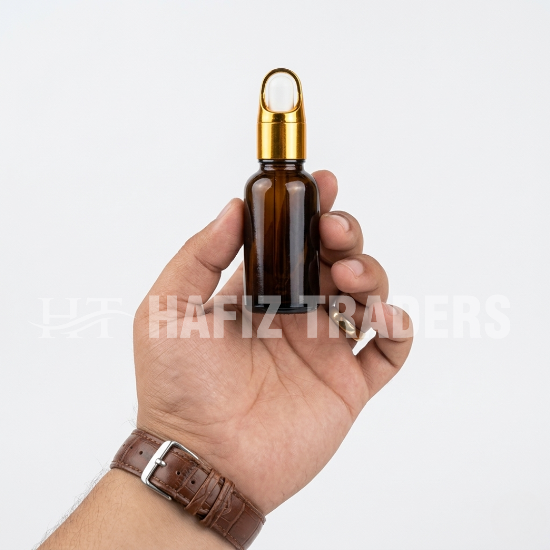 Empty amber serum bottle with golden cap