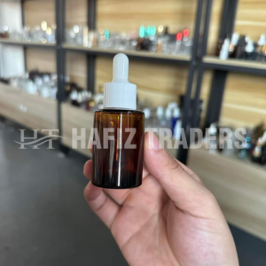 Empty amber serum bottle with cap